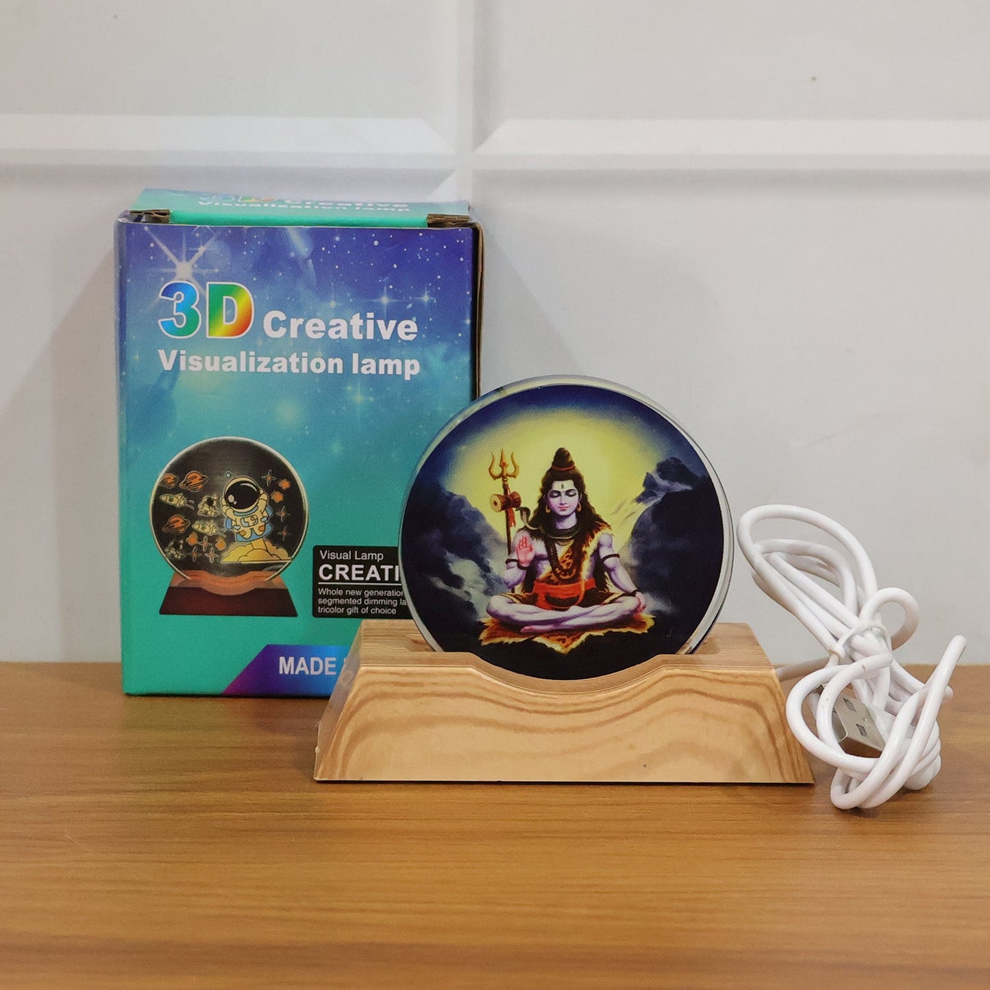 Lord Shiva LED night lamp illuminating living room setup with warm light