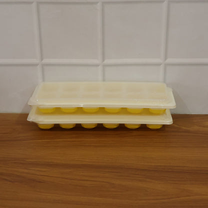 Easy release silicone ice cube maker with 24 compartments and lid.