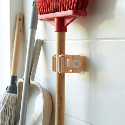 Self-adhesive stick holder clip mounted firmly on wall