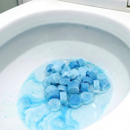Automatic toilet tank cleaner tablet dissolving during flush