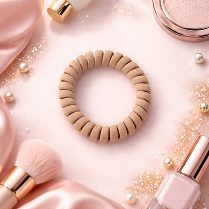 Single soft stretchable spiral coil hair band displayed on a white background.