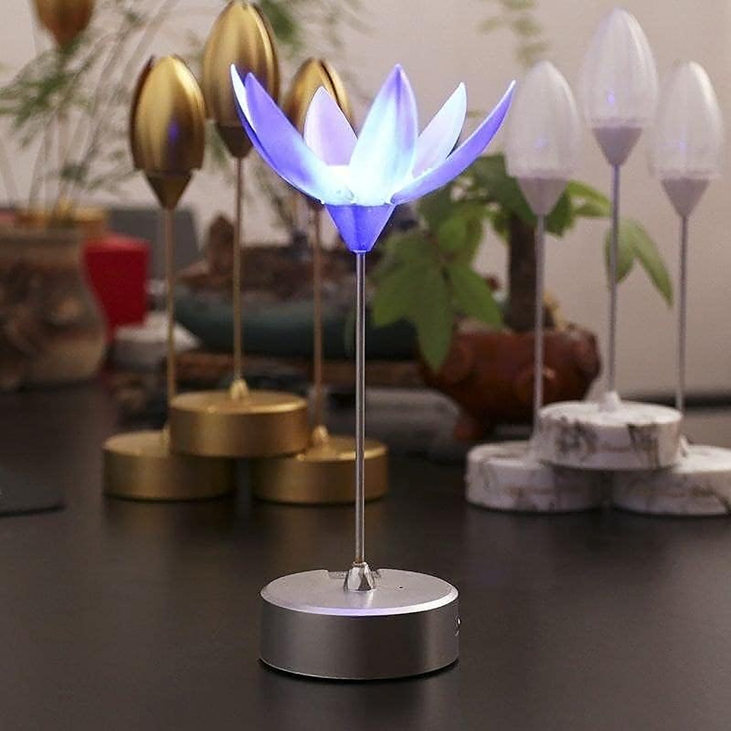 The decorative lotus lamp illuminating a room, creating a peaceful and inviting atmosphere.