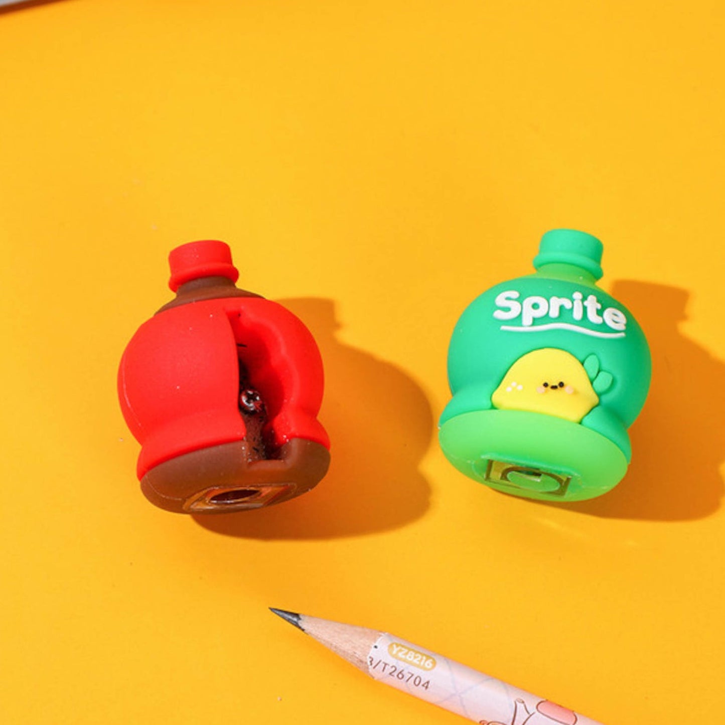 A 3D cold drink bottle shape pencil sharpener and eraser set for kids.