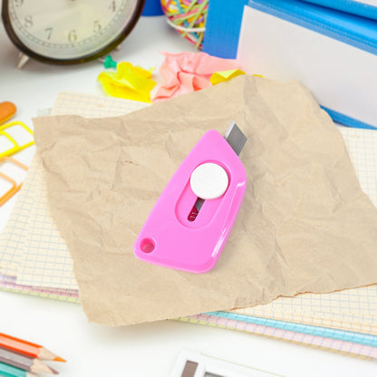 Mini Cloud Cutter utility knife being used to cut a plastic bag smoothly