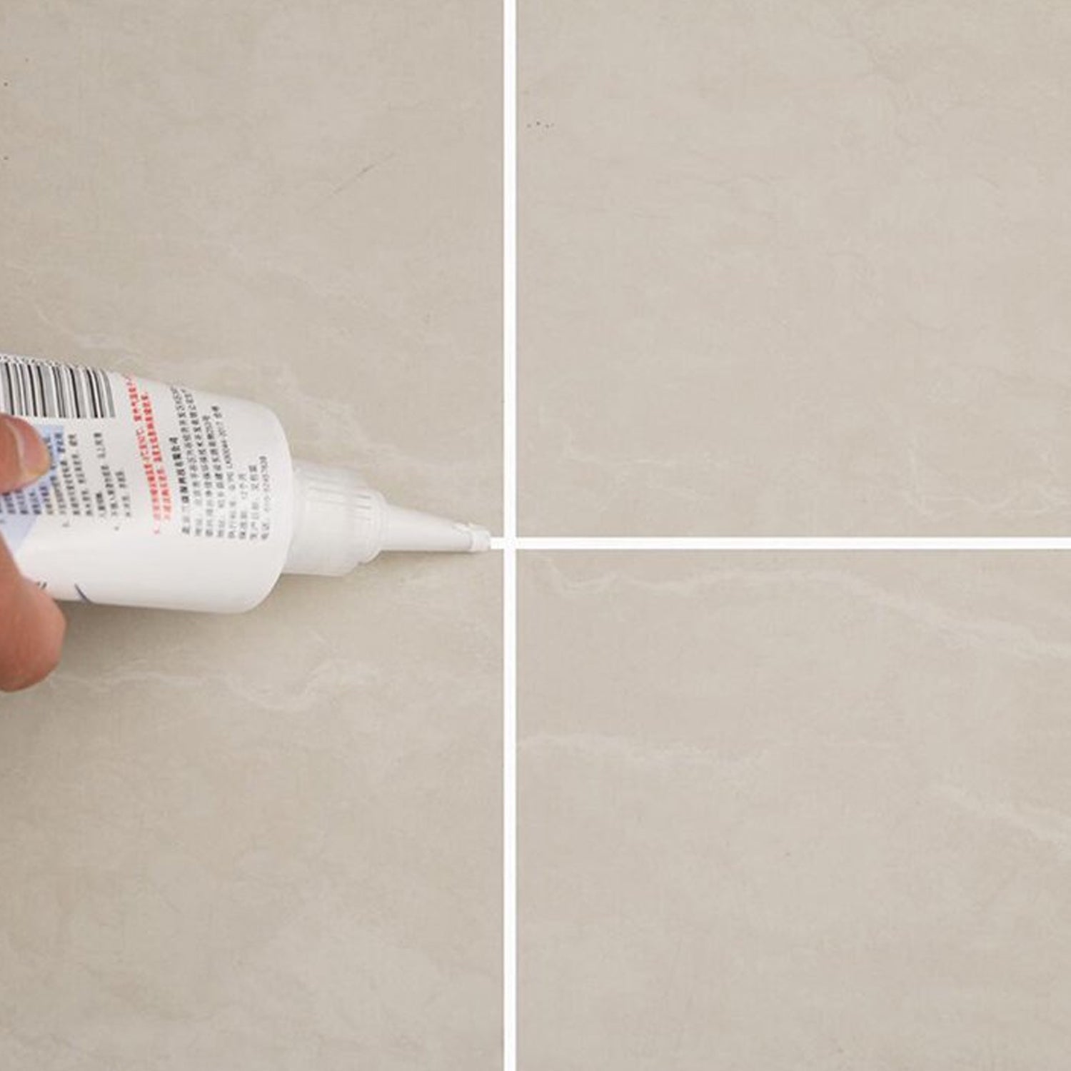 Freshly sealed tiled floor showing clean grout lines after application of the gap filler.