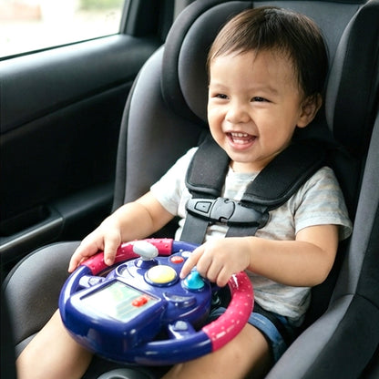 Close-up of child-friendly steering wheel toy featuring bright lights