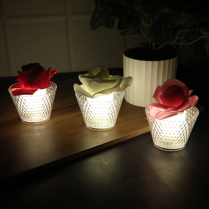 Rose shaped flameless LED candle illuminating indoor party décor
