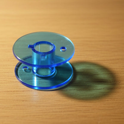 Bobbin set laid out for use with domestic sewing machines