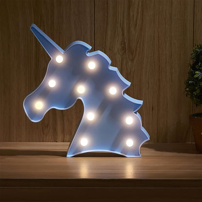 LED table lamp shaped like a unicorn emitting warm light