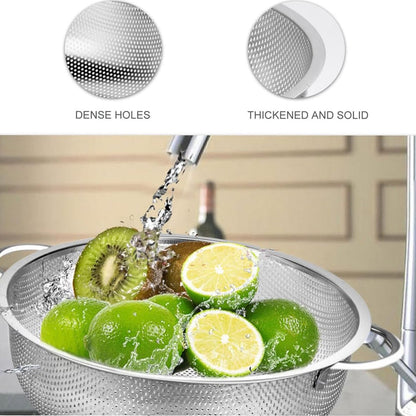 Ergonomic handle detail on the durable stainless steel vegetable colander.