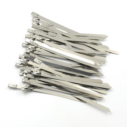 An array of durable stainless steel cable ties laid out, highlighting their uniform design and quality.