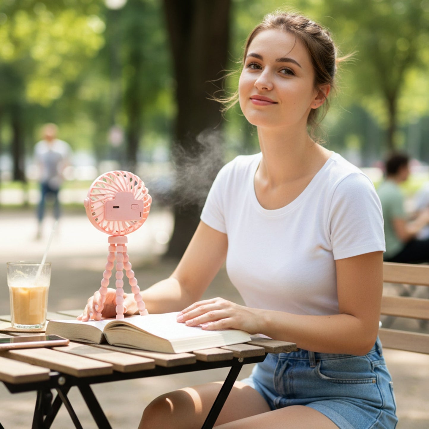 Flexible tripod mounted portable rechargeable fan cooling an indoor area