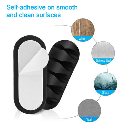 Multi-use cable clips securing headphones and USB wires on a bedside table.