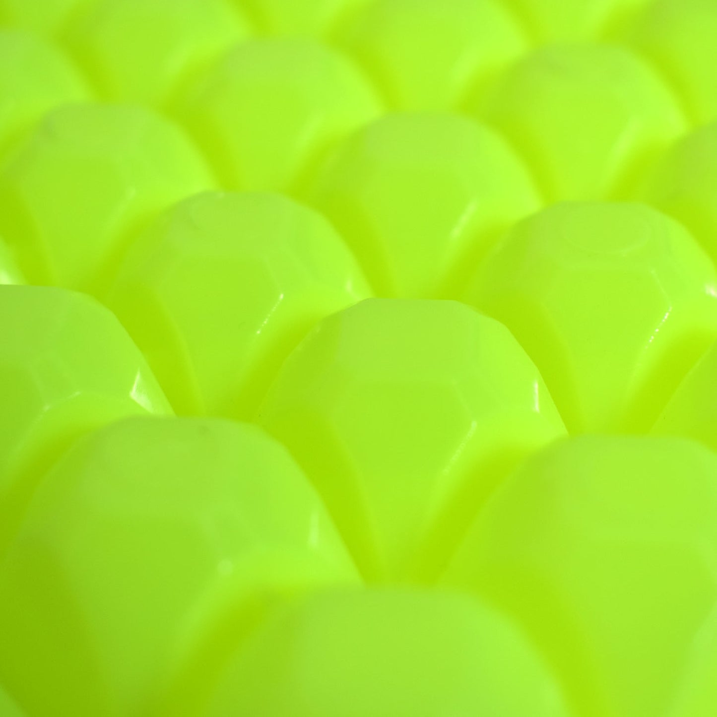 A stream of water filling the easy release ice tray cavities.