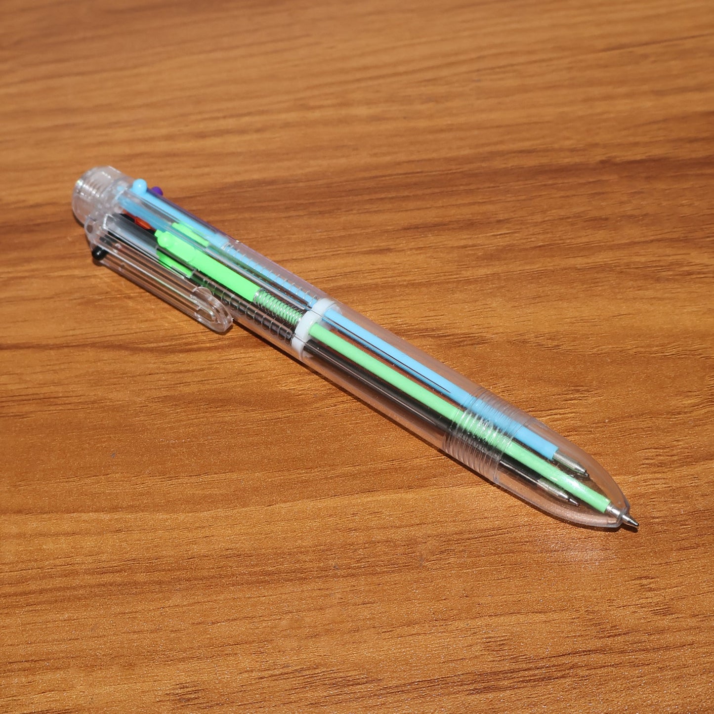 Compact multicolor ball pen designed for portability in pencil cases and bags.