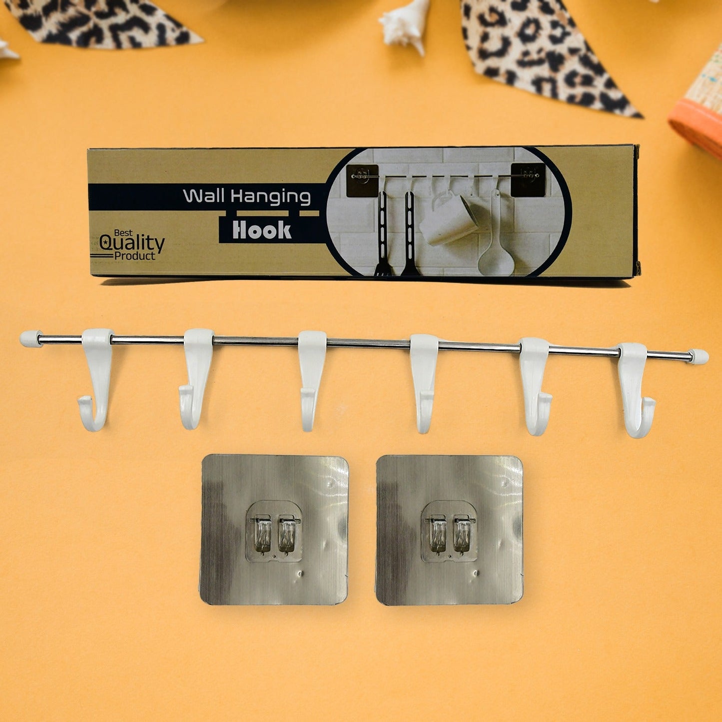 The utensil hanger rail mounted on a kitchen wall, neatly holding various kitchen ladles and tools.
