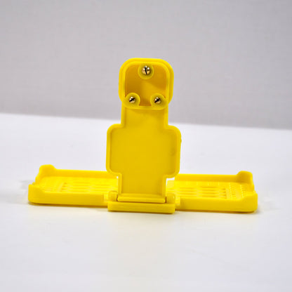 Back view of the PHOBIA yellow mobile charging wall holder, ready for installation.