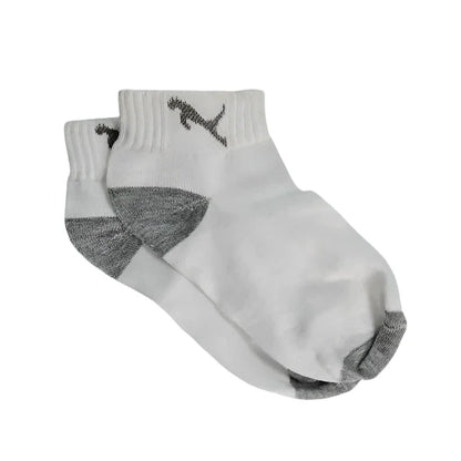 Close-up of a model's feet wearing comfortable, colourful printed socks.