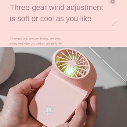 White multi-function fan detached from its base, highlighting its travel-friendly design.