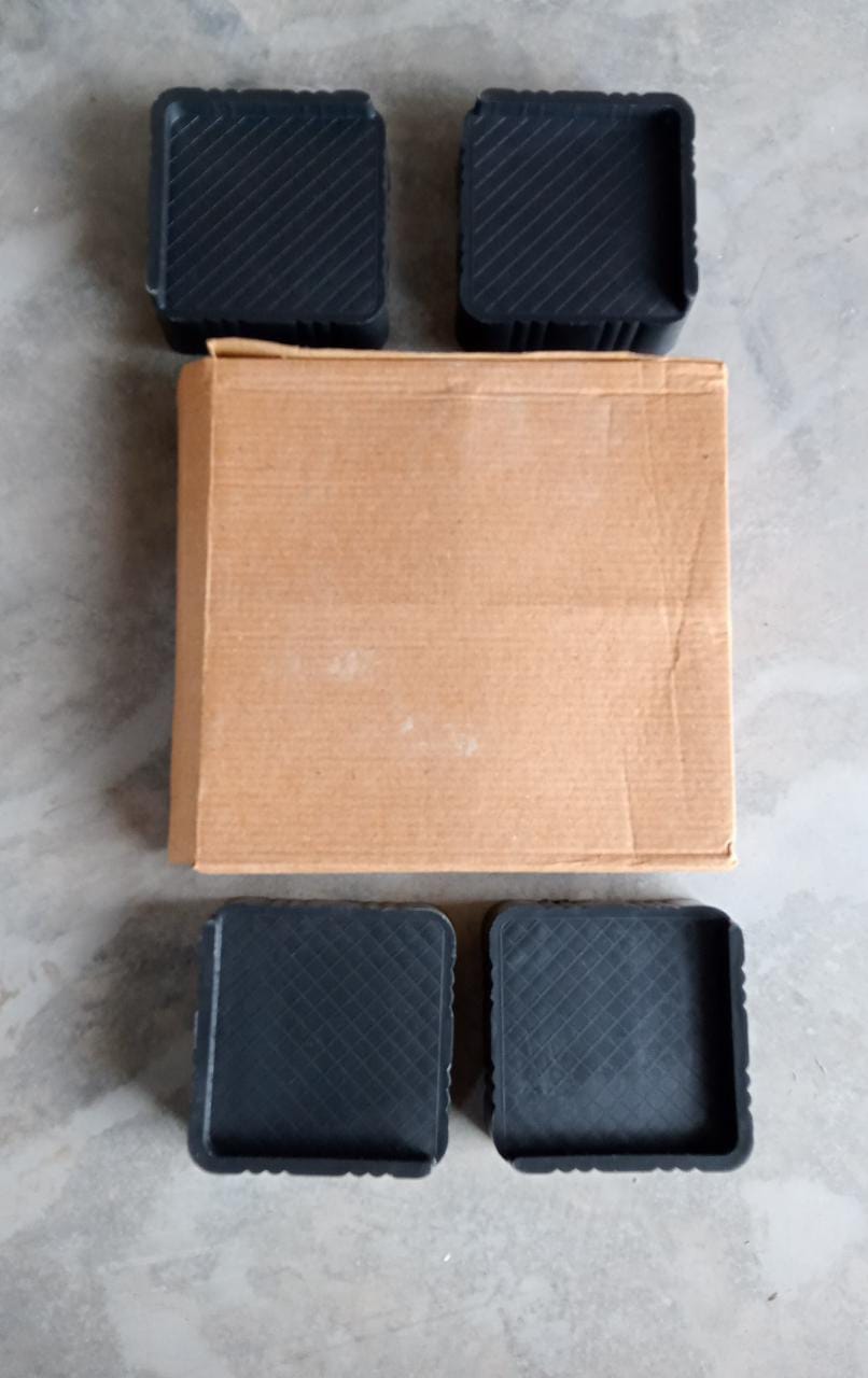 Adjustable base stands providing stable support for a washing machine.