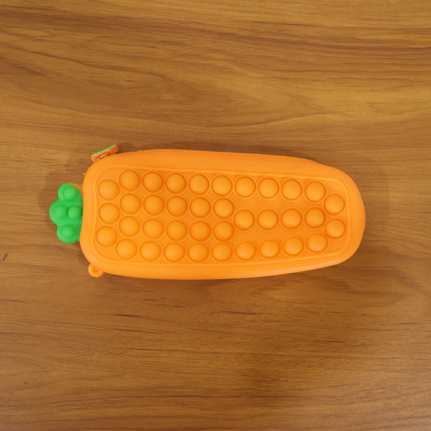 Person holding Pop It silicone pencil pouch during use