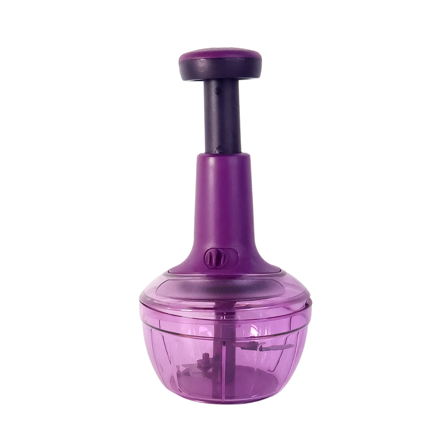Manual push vegetable chopper placed on kitchen counter with chopped vegetables