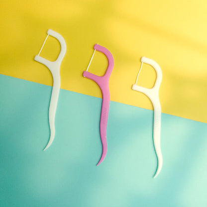 Resealable pack of 20 dental floss picks for convenient storage.