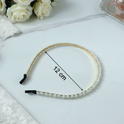 Decorative pearl studded gold hair band for festive occasions