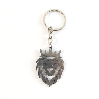 Angled view of metal lion head keychain highlighting textured craftsmanship