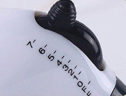 Ergonomic electric hand blender whipping cream in a bowl.