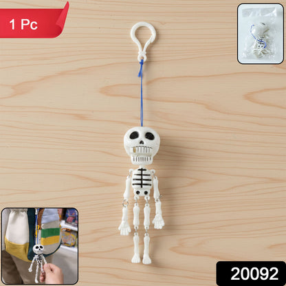 Close-up of skeleton keychain charm with articulated limbs