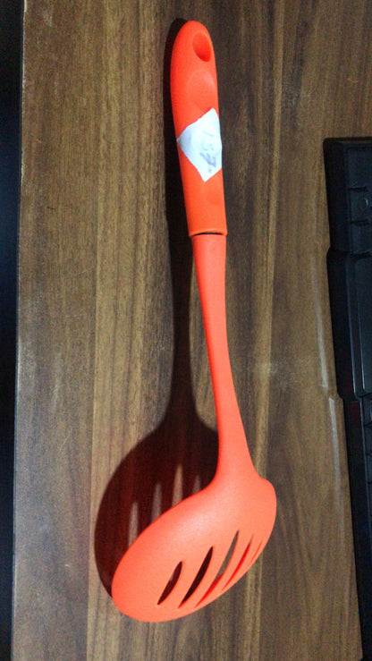 The robust nylon cooking shovel with a large scoop, ready for various culinary uses.
