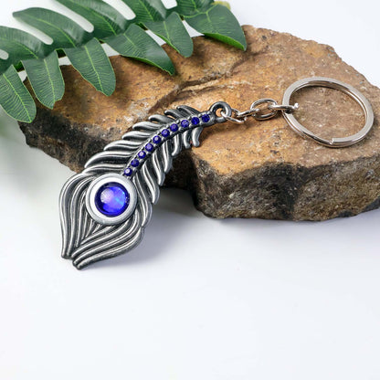 Close-up image showing peacock eye design on metal keychain