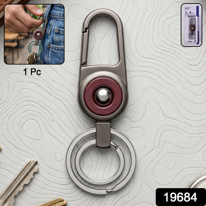 Close-up of metal key holder with sleek modern finish and secure locking carabiner